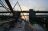 Voor een gesloten Schellingwouderbrug. Strijken om 's nachts door Amsterdam te kunnen varen.
